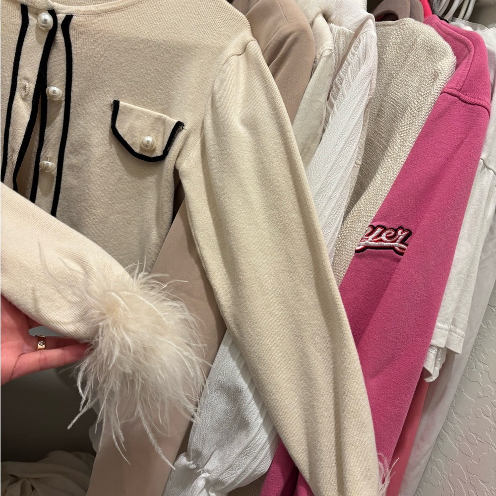 Elegant Cream Top with Feather Detail